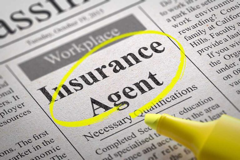 Driver reviews a rental agreement and insurance documents beside car keys and a parked vehicle.